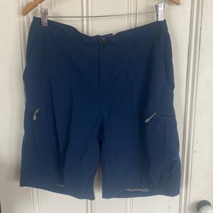 Reel Life shorts or maybe swim trunks.  Mesh pockets with zippers mens large.